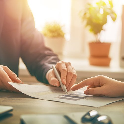 person reviewing printed report