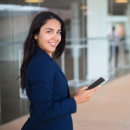 woman smiling holding ipad