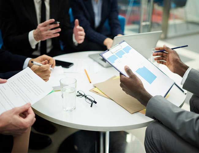 Business people strategizing at a table