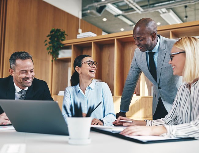 Smiling office employees in meeting