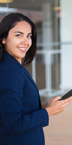 woman smiling holding ipad